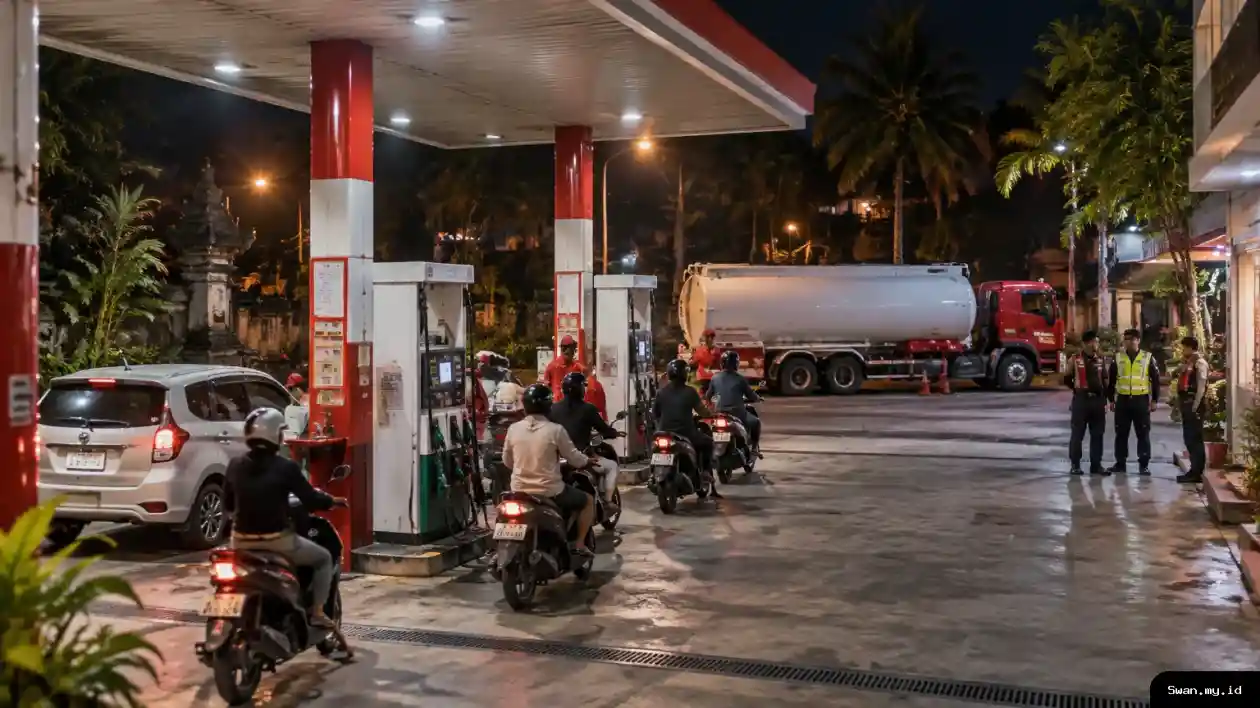 A night view of a busy Bali fuel station, with motorists at the pumps and a tanker supporting the island’s round-the-clock fuel service. Fuel station operating at night in Bali