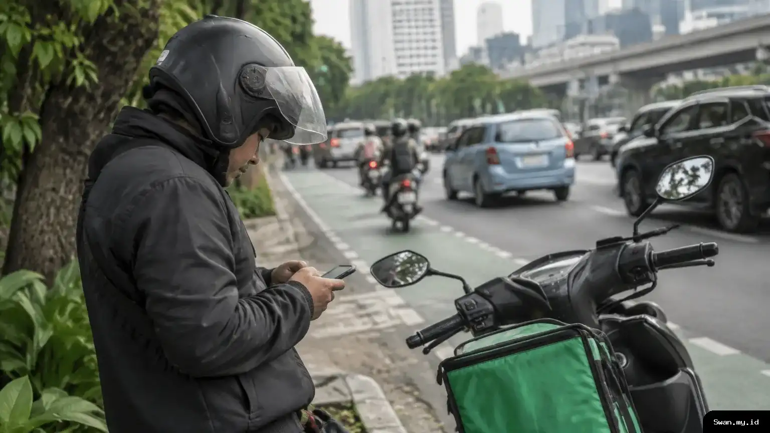 A motorcycle ride-hailing driver pauses at a city street corner and checks a phone beside a parked scooter, illustrating the questions drivers face as Indonesia’s new platform-transport rules take effect. An Indonesian ride-hailing driver waits beside a motorcycle and checks a phone.